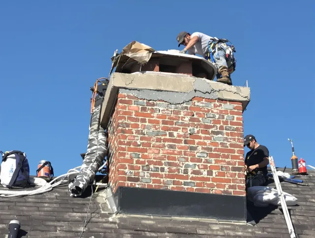 Glendora Chimney Sweep installing a custom chimney crown in Glendora, CA